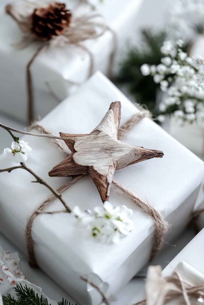 This image shows a simple and elegant Christmas wrapping idea with a natural touch