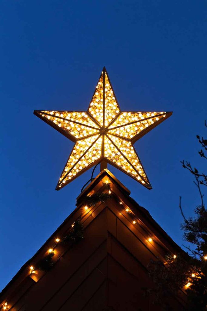 Star-Shaped Tree Topper Lights on Roof Peak