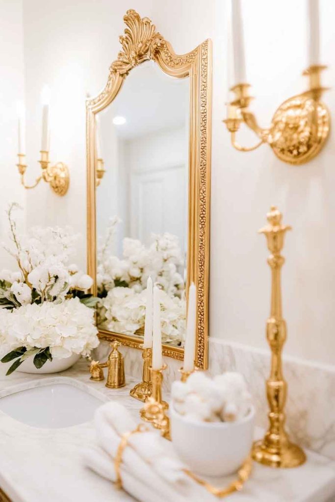 Luxury White Christmas Powder Room with Golden Mirrors
